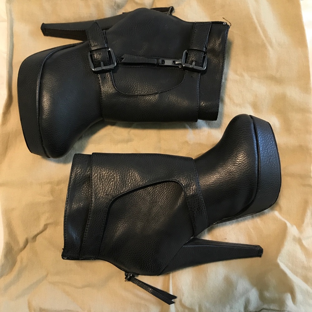 High heeled buckled booties